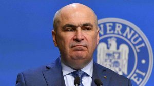 Tensiuni în Parlament: Reacțiile față de plecarea lui Bolojan și impactul asupra coaliției de guvernare